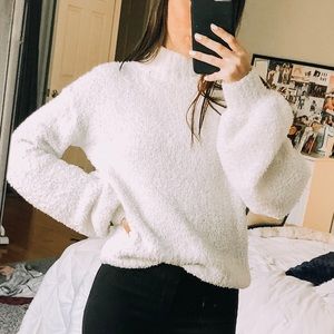 white fuzzy sweater